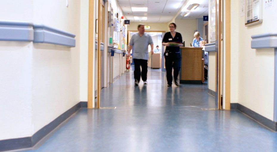Hospital ward with two people in the distance